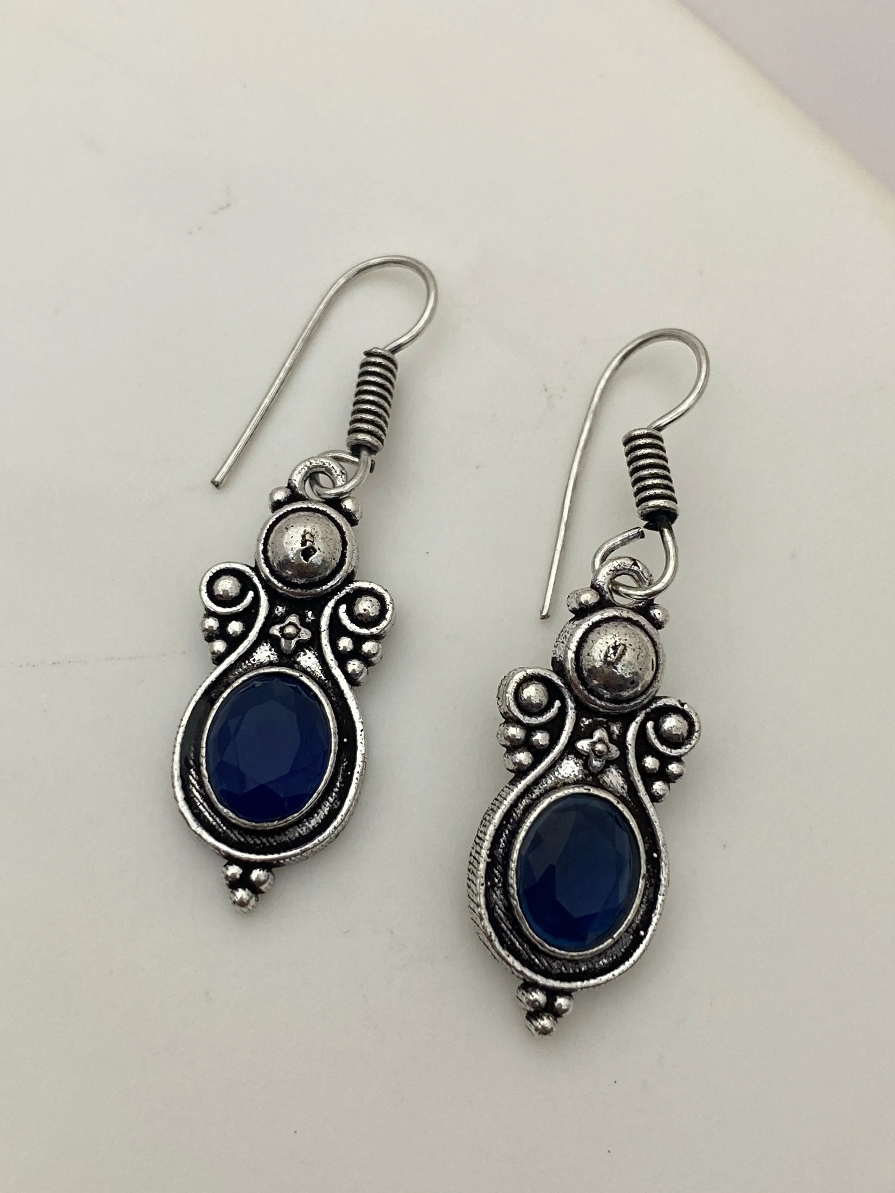 Fascinating Oval Shaped Blue Stone Beaded Silver Toned Oxidized Hook Earrings